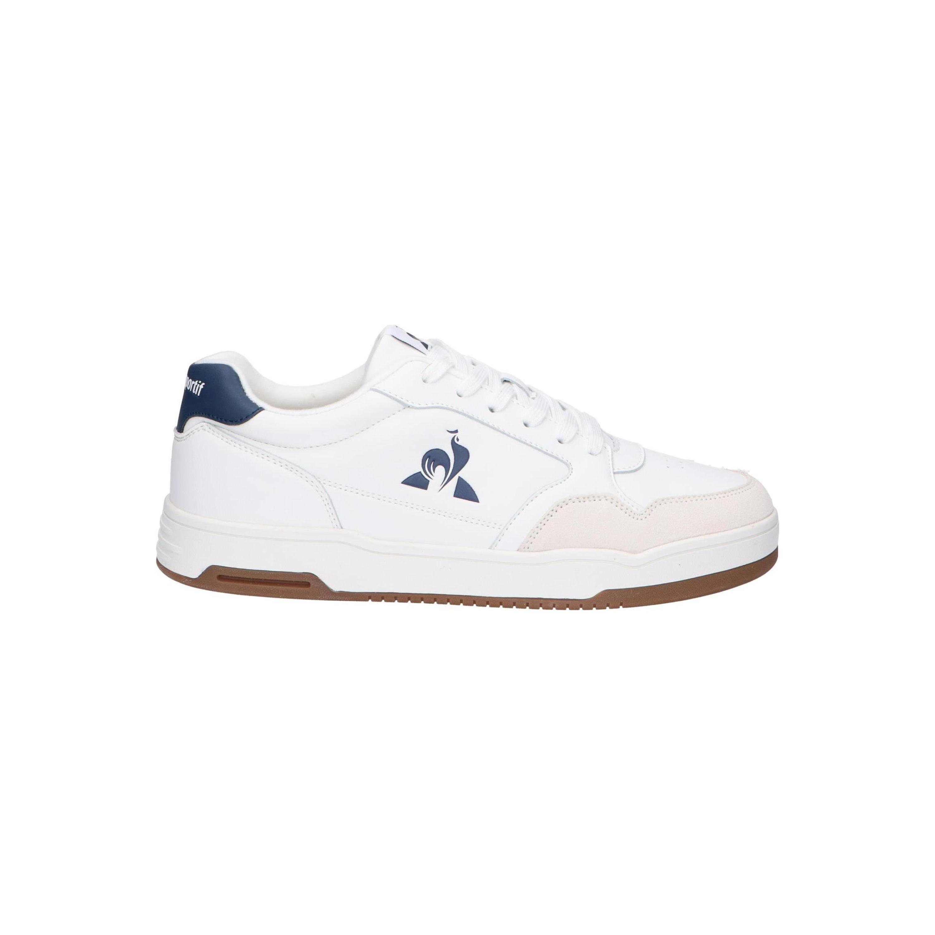 White casual sneakers for men by Le coq sportif, made of leather with a rubber sole and lace-up closure, offering breathable comfort and a lightweight design, perfect for outdoor activities and versatile wear, ideal men's sneakers.