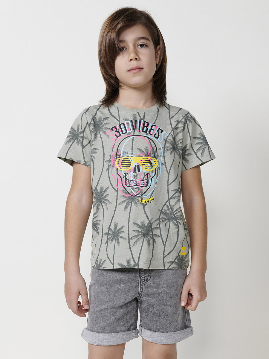 Koroshi - Camiseta de niño manga corta con estampado frontal de calavera y palmeras en color kaki, 95% algodón y 5% elastano, suave y elástica para uso diario