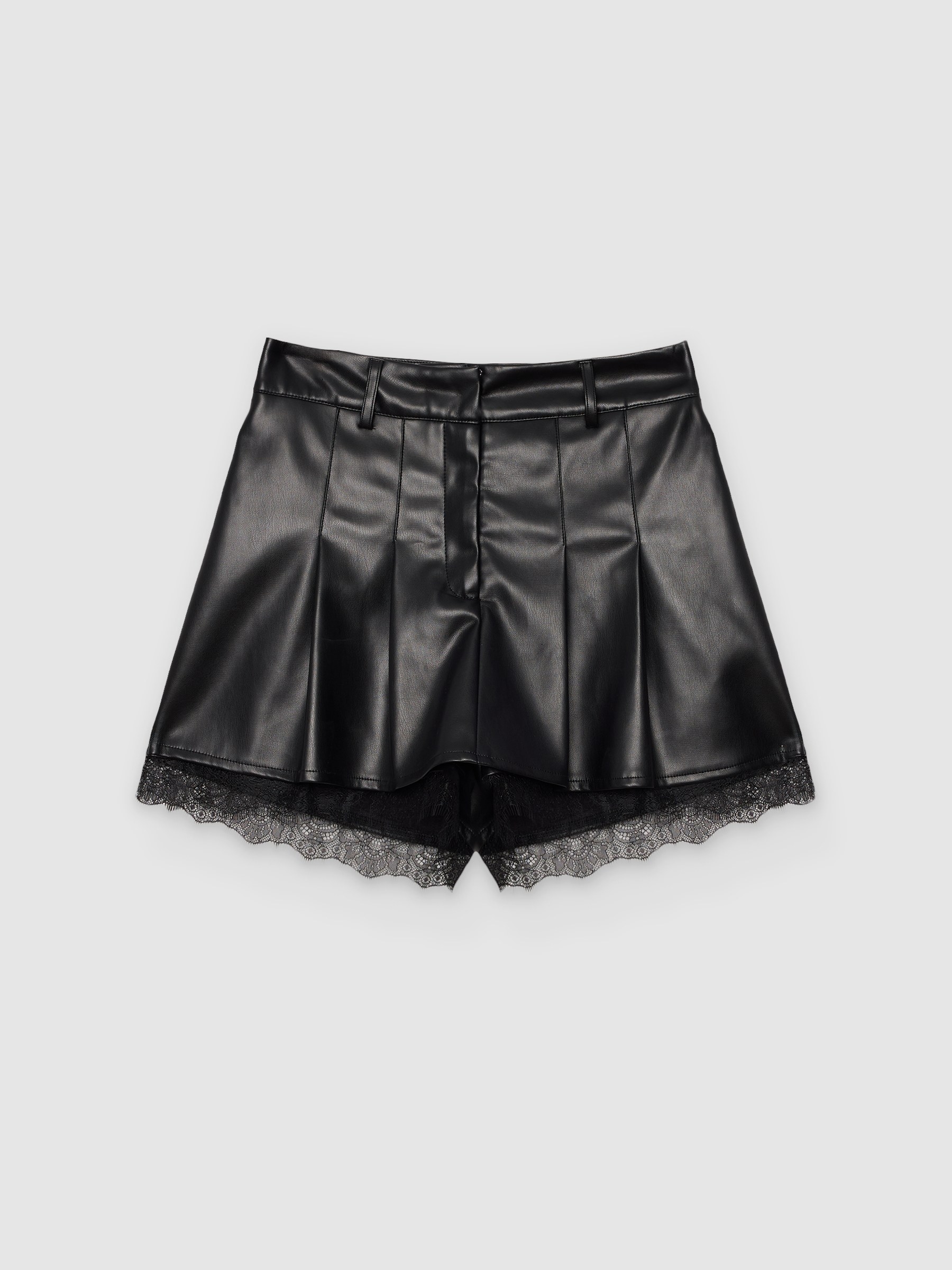Falda pantalón tiro alto efecto piel, con encaje y bajo transparente; cintura elástica y vuelo adaptable INSIDE