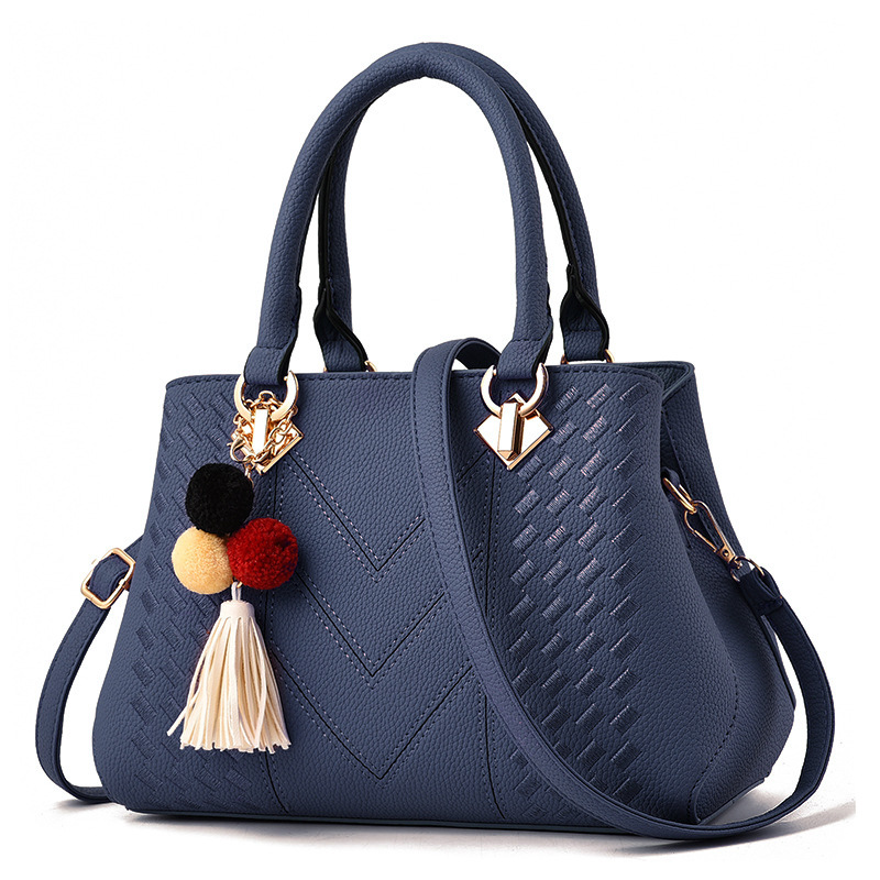 Bolso de mano para mujer, tipo bandolera con asa superior, decorado con pompones y borlas