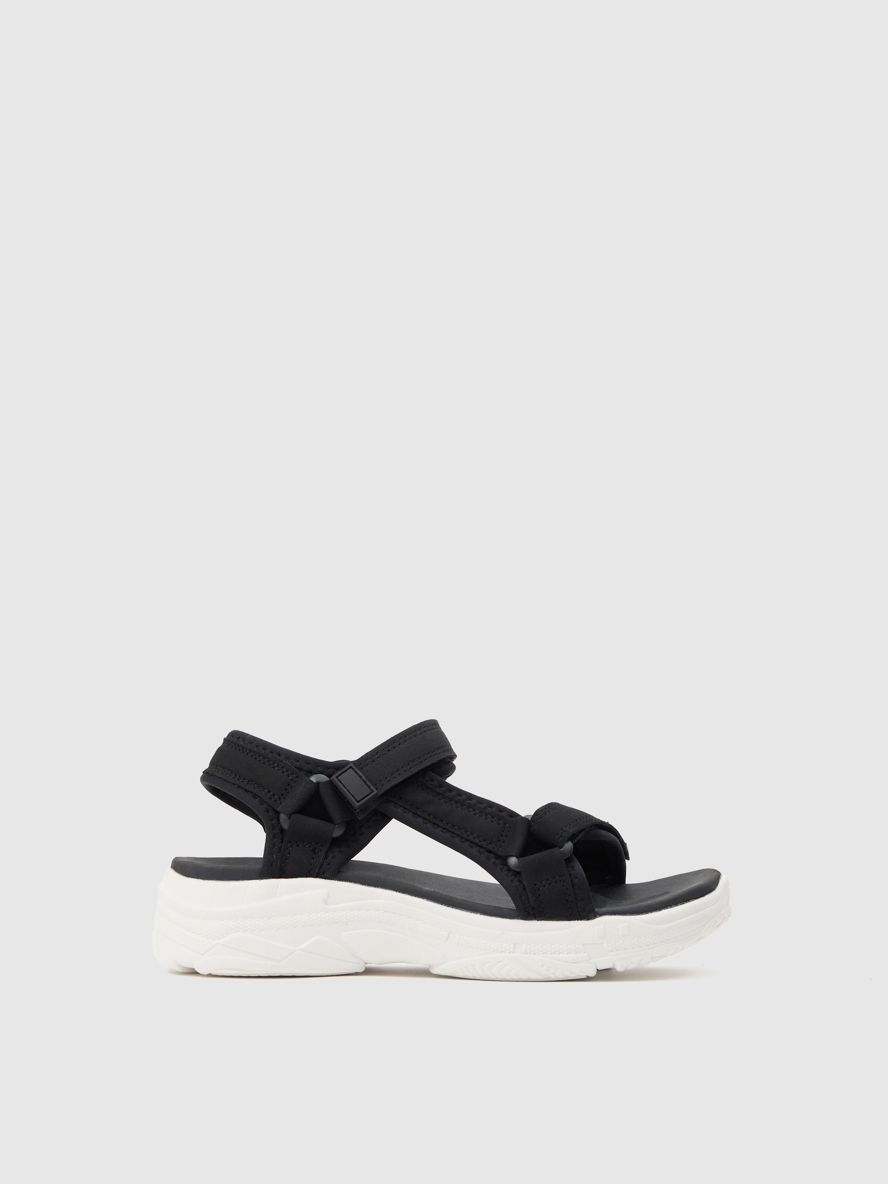 Sandalia deportiva negra con tiras adherentes y suela blanca con volumen INSIDE