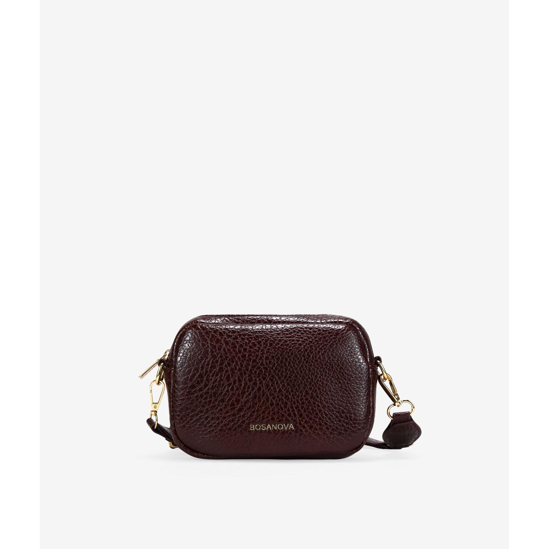 Bosanova Bolso bandolera rectangular pequeño para mujer con argollas metálicas en el asa de cruzar. Cierre con cremallera.