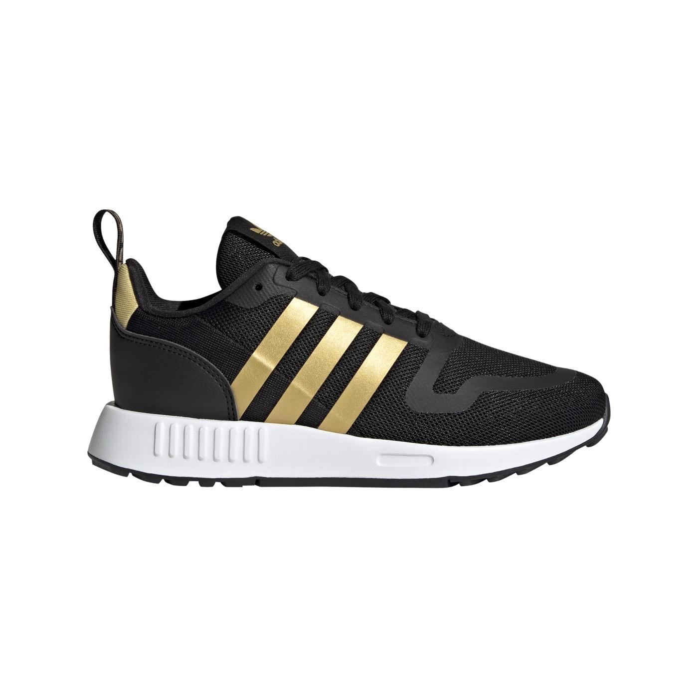 Zapatillas adidas multix j negro dorado de niño.