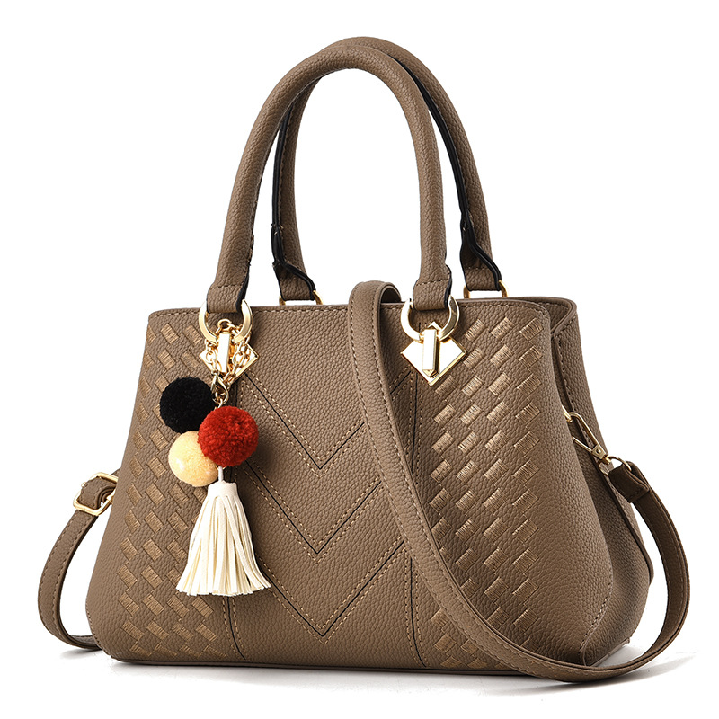 Bolso de mano para mujer, tipo bandolera con asa superior, decorado con pompones y borlas