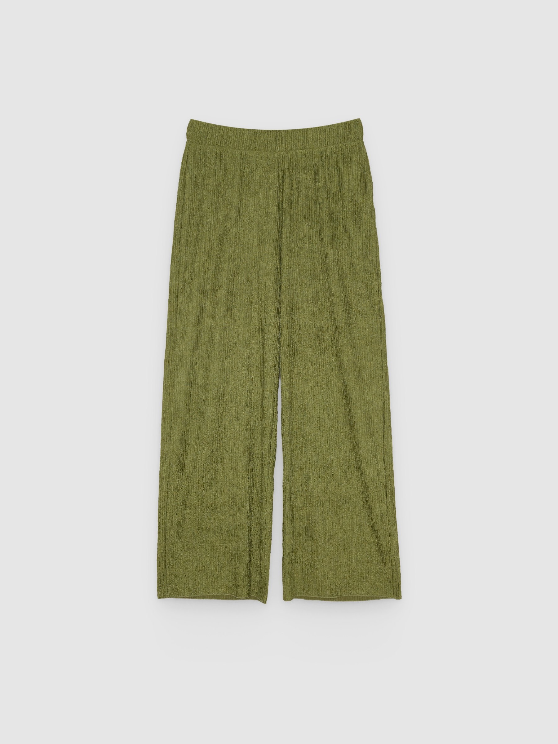 Pantalón fluido de tiro alto, wide leg y cintura elástica; tejido texturizado y movimiento suave con caída INSIDE