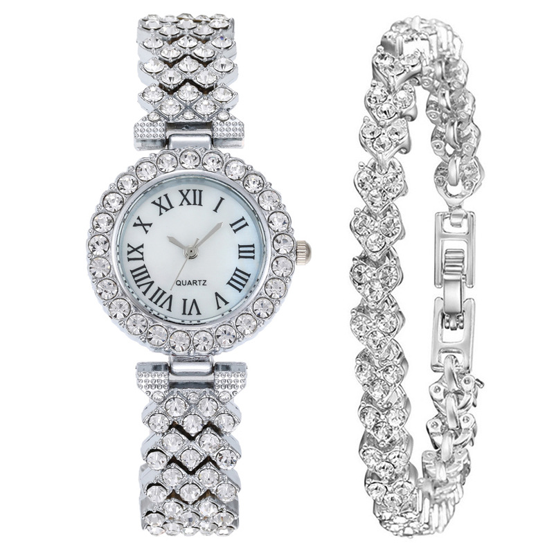 TK Reloj para mujer con piedras brillantes, letras romanas, movimiento de cuarzo, correa de brazalete, un reloj de lujo para la mujer