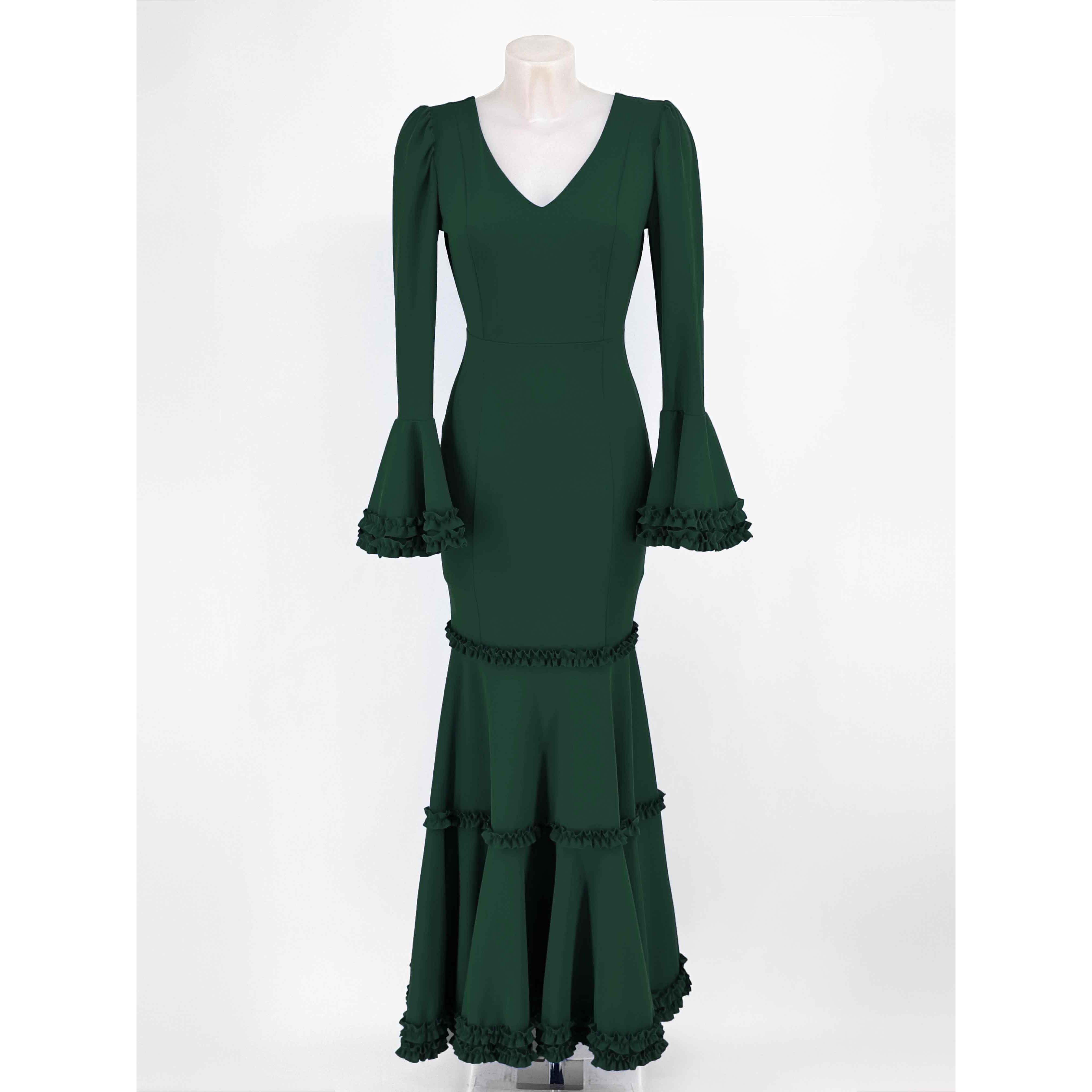 Vestido largo de fiesta en tejido scuba crepe para invitada o eventos. Diseño entallado sirena con escote en V, mangas acampanadas con volantes y falda con volantes escalonados. Disponible en varias tallas y tonos para deslumbrar en tu ocasión especial.