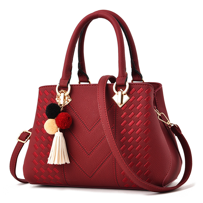 Bolso de mano para mujer, tipo bandolera con asa superior, decorado con pompones y borlas