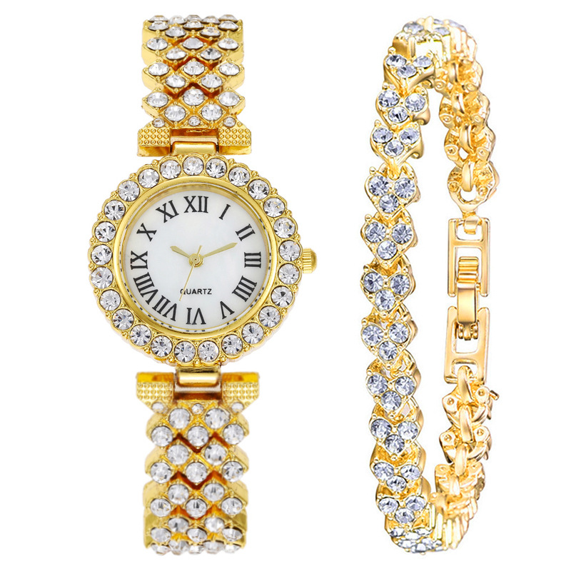 TK Reloj para mujer con piedras brillantes, letras romanas, movimiento de cuarzo, correa de brazalete, un reloj de lujo para la mujer